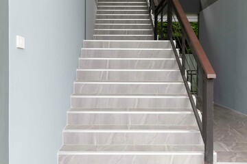 Fototapeta na wymiar Brown granite stairs inside a modern luxury hotel