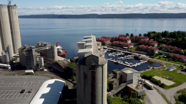 Slemmestad is a small factory town outside of Oslo, Norway. It is the location of the old Norcem factory- The town was once populated solely by workers from the factory. Flight over one of the silos.