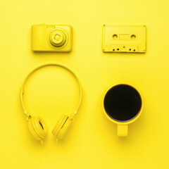 A creative set of cafes and computer accessories on a yellow background. Color trend.