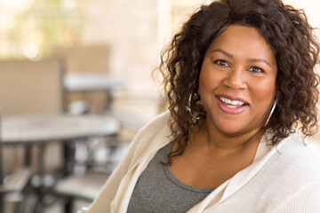 Beautiful mature African American woman smiling and laughing.