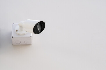 IP CCTV camera install on white concrete wall camera is home security system concept.