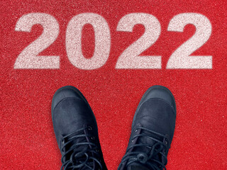 Black shoes on 2022 concrete background, Startup, plans and success in this year