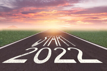 The word start 2022 written on asphalt road at sunrise, New life change 2022 plan concept, Concept for new year 2022,