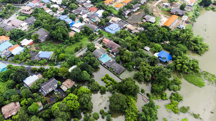 Flood waters overtake a house and rice field at Central of Thailand in 2021. Many buildings are...