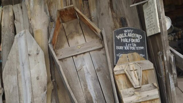 Open Coffin Made Of Wood Displayed At A Scrapyard In Jerome, Arizona. close up