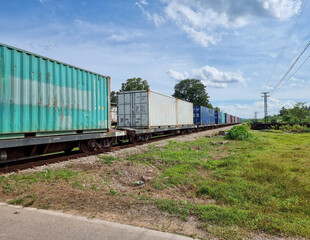 The train is carrying containers. diesel engine train of Thailand