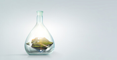 Landscape with mountain inside glass bottle . Mixed media