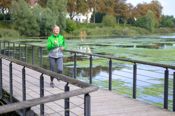 Healthy lifestyle concept with active woman out jogging