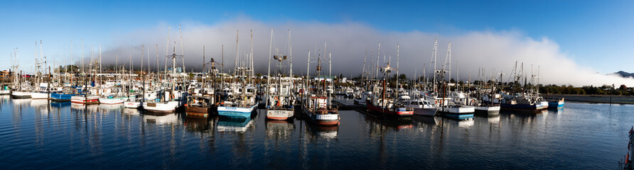 Fototapeta na wymiar Panorama of Boats in Garibaldi Oregon harbor with clearing fog