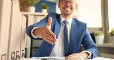 Young smiling businessman giving his hand for handshake 4k movie