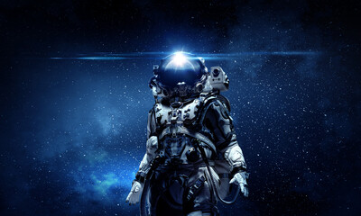Astronaut walking on an unexplored planet - 462995716