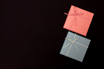 Christmas gift boxes isolated on black background, except copy space.