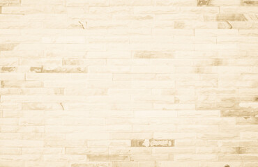 Empty background of wide cream brick wall texture. Beige old brown brick wall concrete or stone textured, wallpaper limestone abstract flooring/Grid uneven interior rock. Home decor design backdrop.