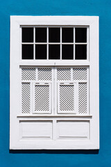Traditional white painted window in canarian colonial style house in the old town of Santa Cruz de La Palma, in the quarter of San Sebastian, also known as La Canela