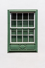 Traditional green painted window in canarian colonial style house in the old town of Santa Cruz de La Palma, in the quarter of San Sebastian, also known as La Canela