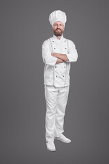 Smiling chef in white uniform