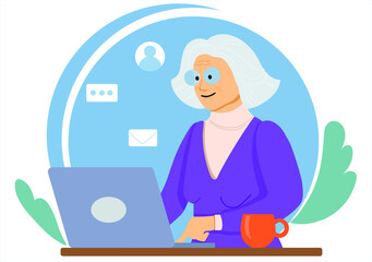 Happy grandma sits at the computer. Senior woman studies and studies modern technologies using a laptop. Communicates on the Internet online. Retired grandmother chatting.