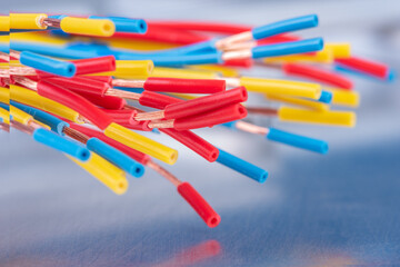 Bundle of colorful electrical copper cables close-up 