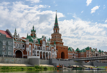 Fototapeta premium Bruges Embankment with the Spasskaya Tower in Yoshkar-Ola, Russia