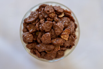 top view of a dairy dessert with chocolate chips in a glass