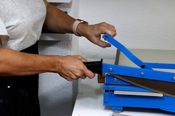 Cutting paper in a workshop