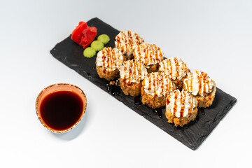 Tempura with an eel on a blackboard on a white background