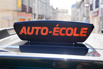 france driving school in france panel on car roof with text french auto ecole