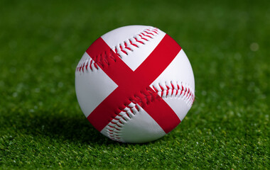 Baseball with Alabama flag on green grass background, close up