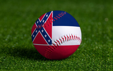 Baseball with Mississippi flag on green grass background, close up