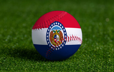 Baseball with Missouri flag on green grass background, close up