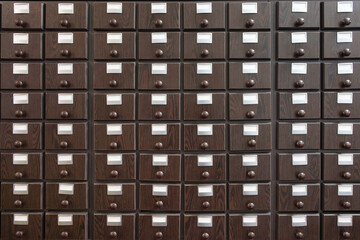 Wooden brown catalog file cabinet, front view