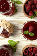 Flat lay composition with raspberry jam on wooden background
