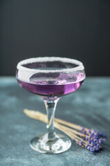 Purple soft lavender cocktail on the rustic background. Selective focus. Shallow depth of field.