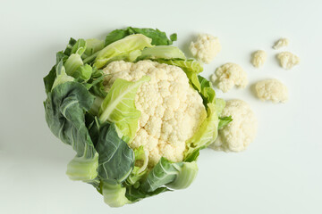 Fresh juicy cauliflower with slices on white background