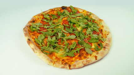 Italian Pizza Salame Calabra with Mozarella Cheese, Rukola, Bacon and Grana Padano on white background. Original dish from Italy . Fast food render. Seperated image.