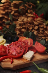 Food photography, plating of cherry tomatoes, mushrooms, peppers and sliced ​​cheese, placed on rustic wooden table