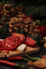 Obraz na płótnie Canvas Food photography, plating of cherry tomatoes, mushrooms, peppers and sliced ​​cheese, placed on rustic wooden table