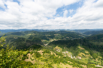 Mountain and forest with dramatic cloudy sky
