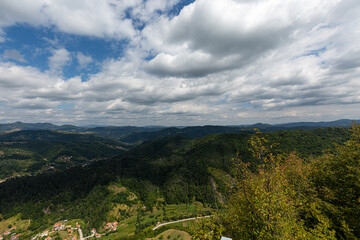 Mountain and forest with dramatic cloudy sky