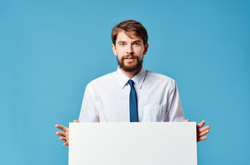 businessmen White mockup poster in hand advertising blue background