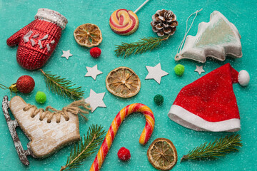 Naklejka na ściany i meble Christmas decorations for the tree, sweets on a green background. Flat lay. There is room for text. Christmas and New Year concept