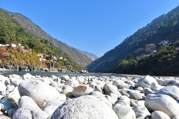 Karnaprayag Chamoli Uttarakhand - The Junction of Alaknanda and Pindari Rivers. Confluence of the...