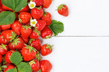 Strawberries berries fruits strawberry berry fruit with copyspace copy space on a wooden board