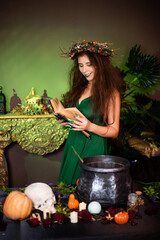 Witch with disheveled hair and long nails with a wreath of dry branches on her head, dressed in a...