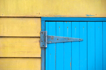 Blue door on yellow wall