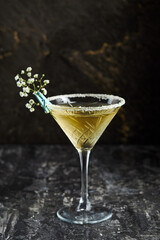 cocktail in a bar served with tiny beautiful flower