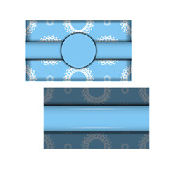 Fototapeta na wymiar Blue greeting flyer with mandala white pattern prepared for typography.