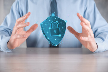Businessman hold low poly polygon shield with a padlock icon.Secure Access System Concept.Business...