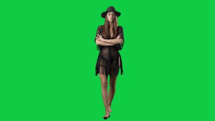 Angry displeased summer girl in bikini staring and camera crossing arms walking. Full body on green screen chroma key background - Powered by Adobe