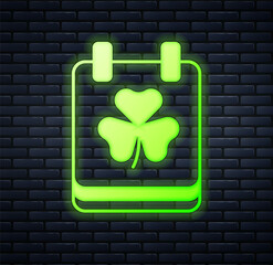 Glowing neon Saint Patricks day with calendar icon isolated on brick wall background. Date 17 March. Vector